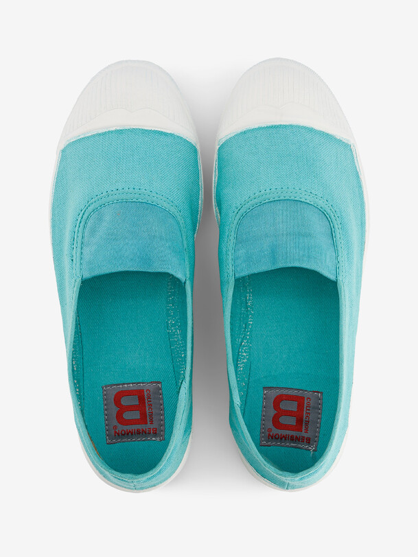 les femmes élastiques de tennis turquoise